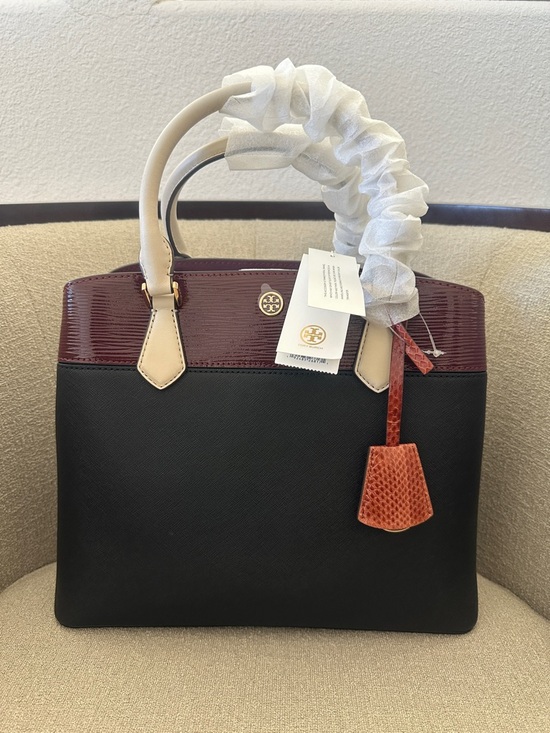 Tory Burch Handbags - NWT Tory Burch Black and Burgundy Satchel with Tan Handles and Orange Charm